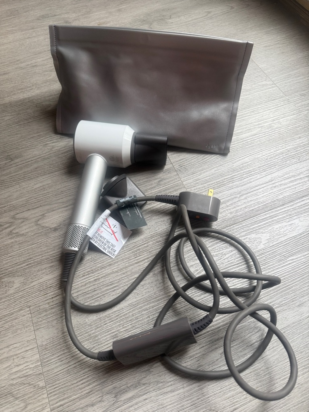 Dyson Hair Dryer in White and Silver with Dark Gray Cord